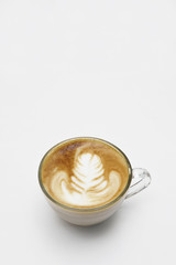 cup of latte art coffee on white background