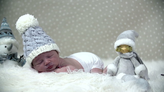 Baby sleeping within a winder looking like scene