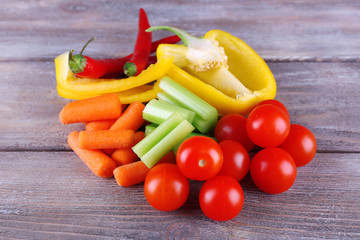 Fresh vegetables on rustic wooden planks background