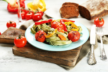 Tasty pasta with pepper, carrot and tomatoes