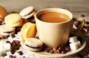 Gentle colorful macaroons and  coffee in mug
