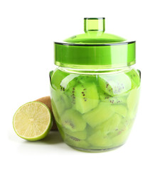 Tasty kiwi jam in glass jar isolated on white