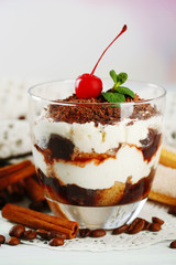 Tasty tiramisu dessert in glass,