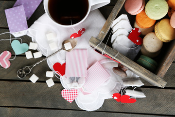 Heart shaped teabag tags, macaroons and cup of tea