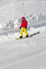 Fototapeta na wymiar Snowboarder on the mountain slope