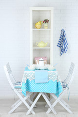Wooden chairs and table in cozy kitchen