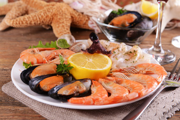 Tasty seafood on plate on table close-up