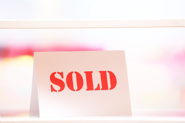 Blank with text sold on bright background