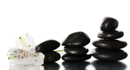 Fototapeta na wymiar Spa stones with flower isolated on white