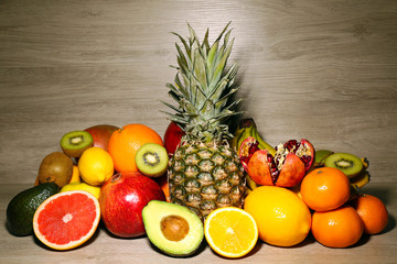 Assortment of exotic fruits on wooden background