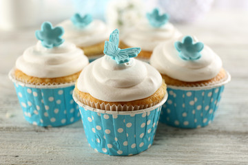 Delicious cupcakes on table close-up