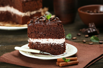 Delicious chocolate cake on table close-up