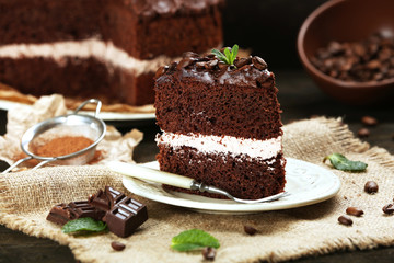 Delicious chocolate cake on table close-up