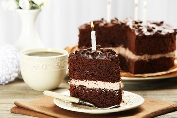 Delicious chocolate cake on table on light background