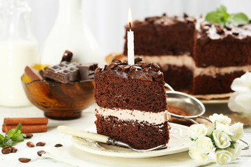 Delicious chocolate cake on table on light background