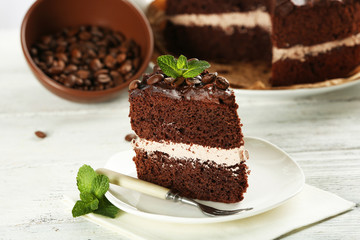 Delicious chocolate cake on table close-up