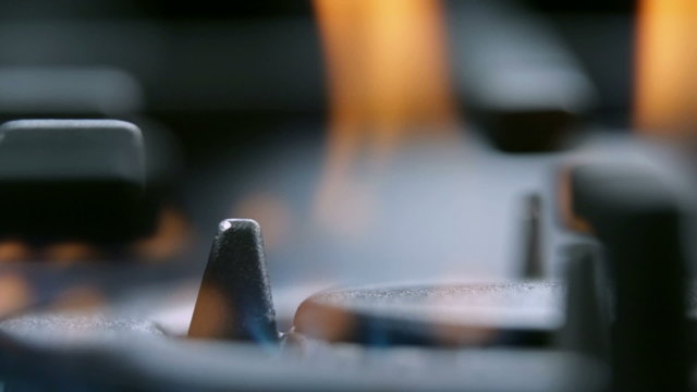 Extreme close up focus on fire from gas cooker