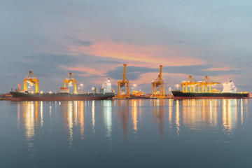 Fototapeta na wymiar Industrial Container Cargo freight ship with working crane bridg