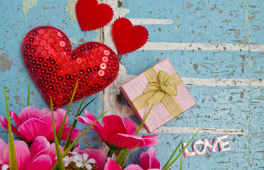 Gift and hearts on wooden board, Valentines Day backgroun