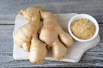 Ginger root and ginger powder in a bowl
