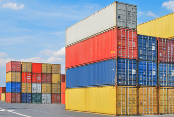 Stacked cargo containers in storage area of freight sea port ter