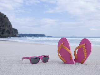 Pink sunglasses and beach sandals