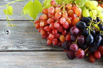 Bunches of fresh grapes on the boards