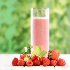 smoothie of berries on the table in the garden