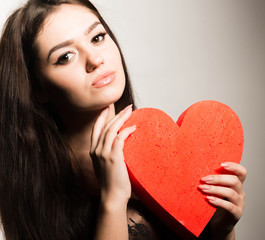 Valentine's Day. Love. Girl holding a heart 