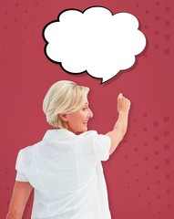 Composite image of happy mature woman writing and smiling