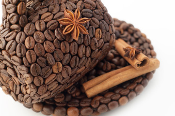 the cup made of coffee beans on the white background