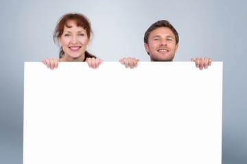 Composite image of couple looking at the camera