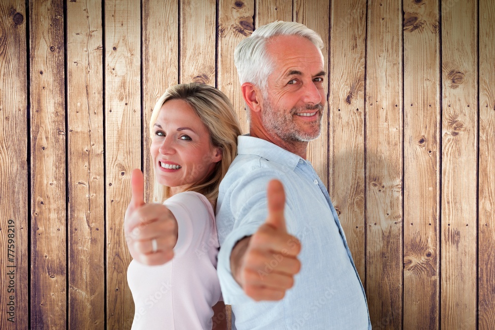 Poster composite image of smiling couple showing thumbs up together
