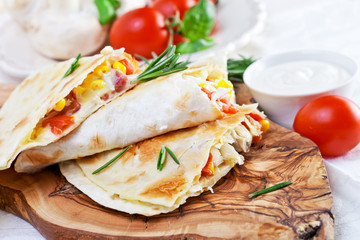 Mexican tortilla with meat stuffing, corn and vegetable salsa