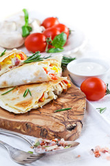 Mexican tortilla with meat stuffing, corn and vegetable salsa