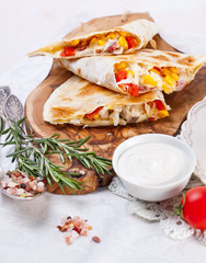 Mexican tortilla with meat stuffing, corn and vegetable salsa