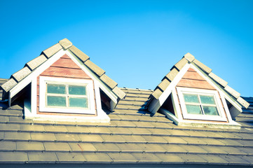 Window on second floor of home.