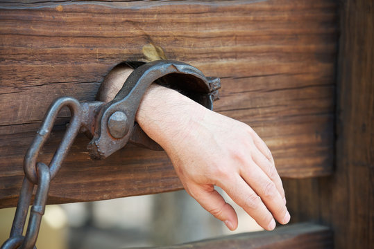 Hand in chains - a symbol of slavery