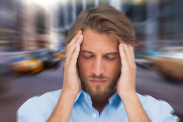 Composite image of man with headache