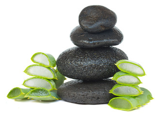 Obraz na płótnie Canvas massage stones with aloe vera