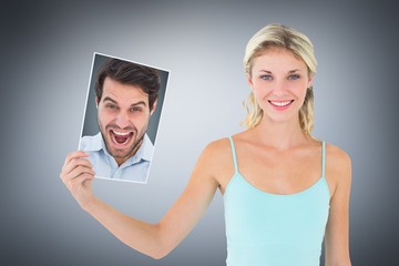 Composite image of cheering man looking at camera