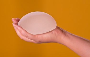 Silicone implants on hand
