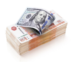 Heap of 5000 russian rubles banknotes and 100 dollar bill