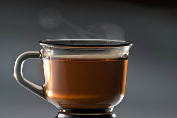 Hot tea cup isolated on gray background