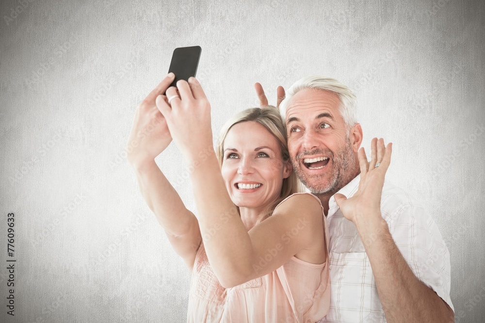 Poster composite image of happy couple posing for a selfie