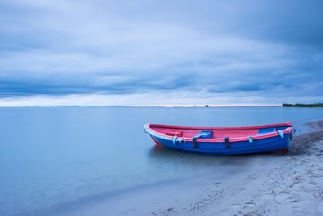 Fototapeta premium Vintage fishing boat during sunset