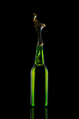 Beer bottle isolated on black background