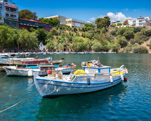 Fototapeta na wymiar Boats on Lake Voulismeni. Agios Nikolaos, Crete, Greece