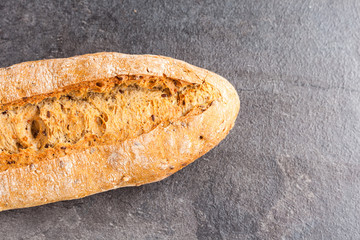Delicious bread on grey background
