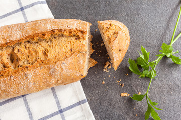 Tasty bread sliced on kitchen towel